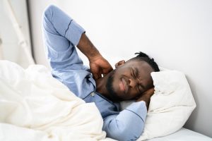 man wakes up with neck pain