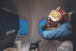 woman is sleeping on a plane